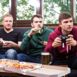 men fans watching football tv drink beer three men drinking beer having fun together bar