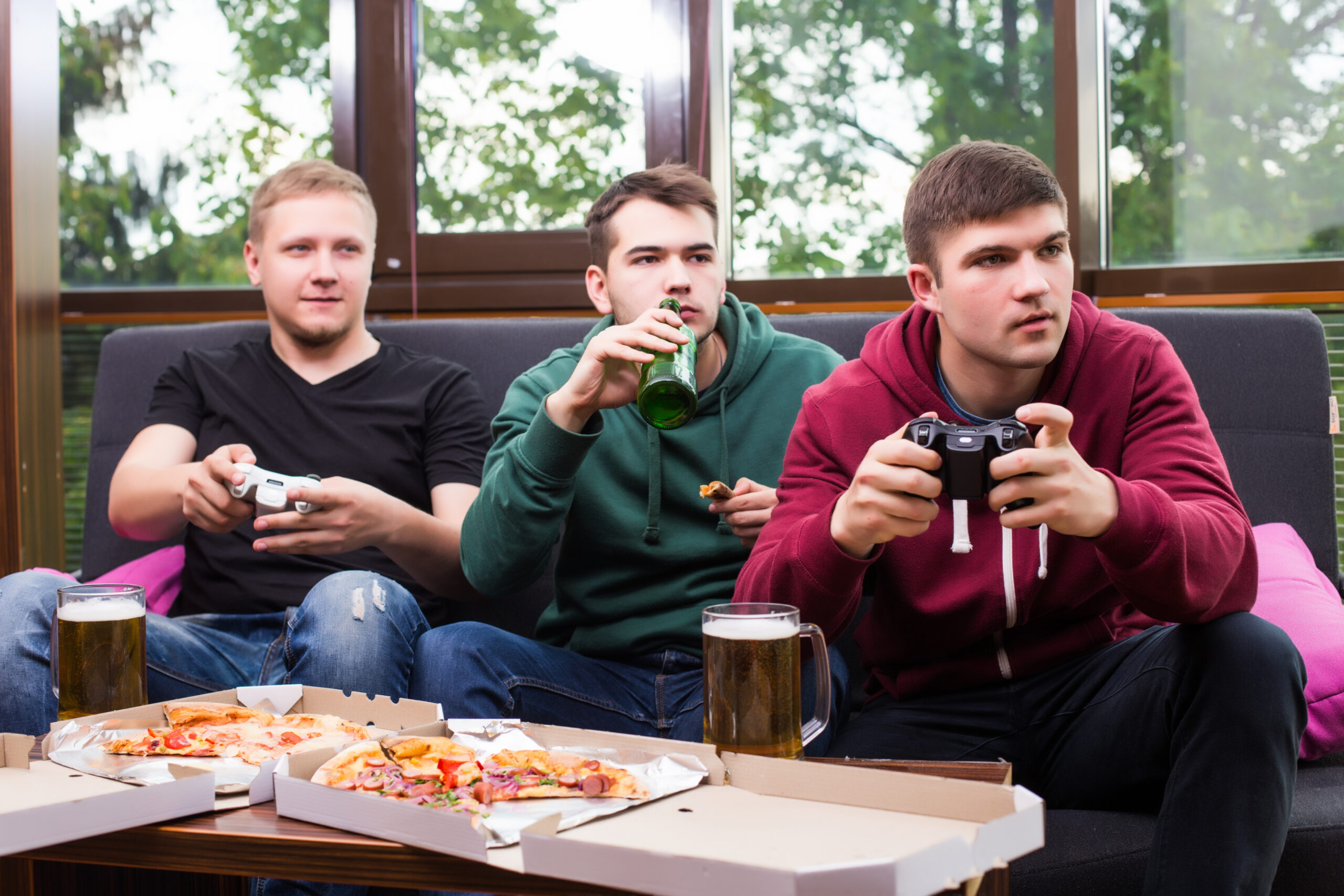 men fans watching football tv drink beer three men drinking beer having fun together bar scaled
